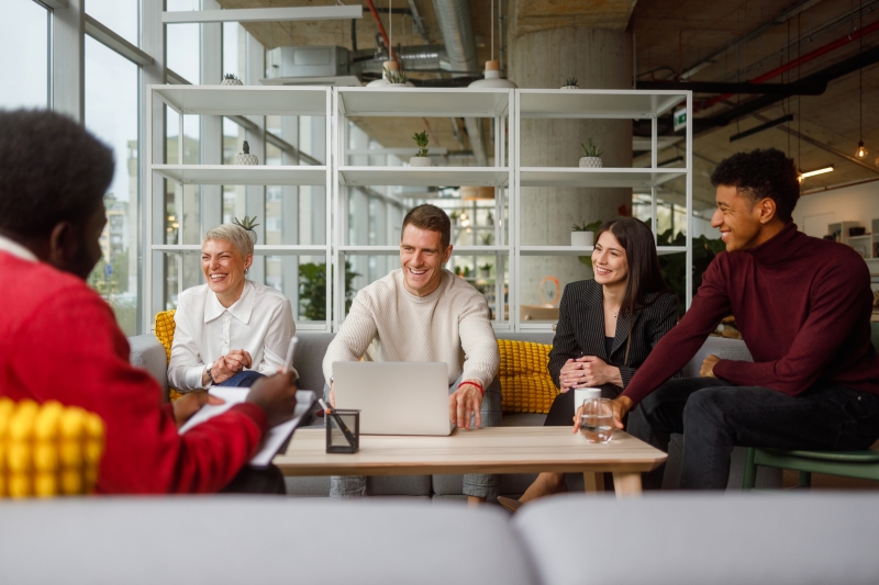 Employees gathered together laughing