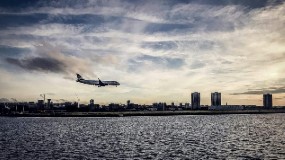 Airplane flying over city