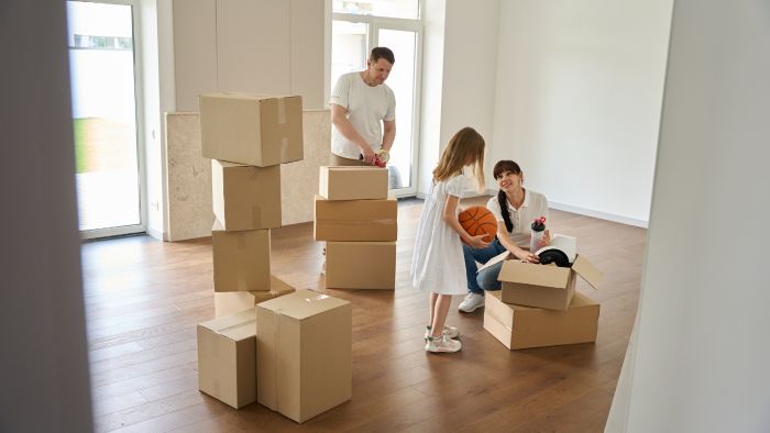 Family packing moving boxes Family packing moving boxes