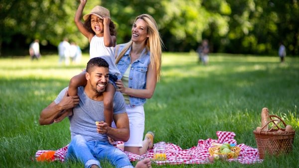 Family of three having a picnic