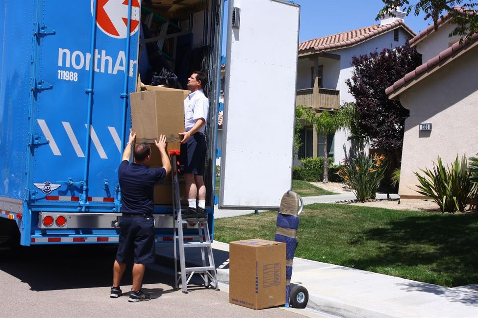 North American employees loading a moving truck