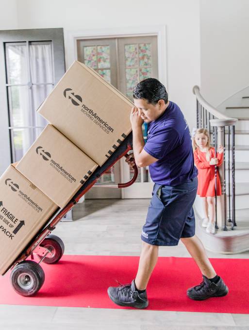 Man moving boxes out of home Man moving boxes out of home