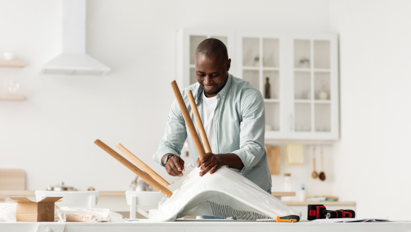 Man disassembling a chair