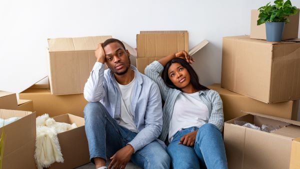 Two people stressed from moving Two people stressed from moving