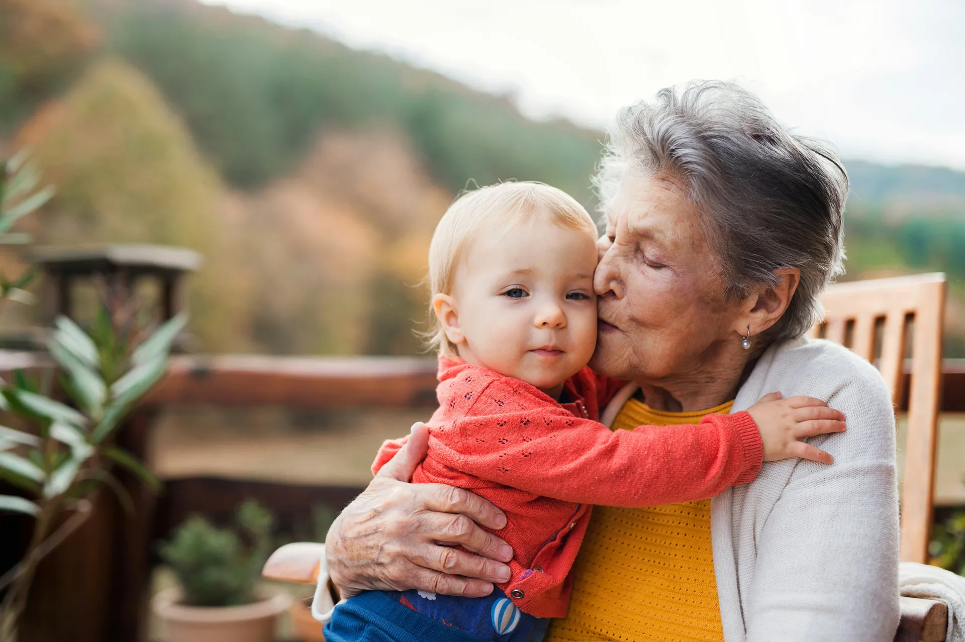 Grandma kissing a baby