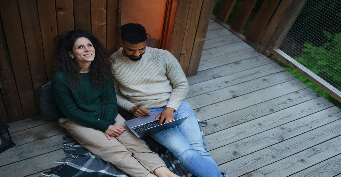 a couple relaxing on a porch